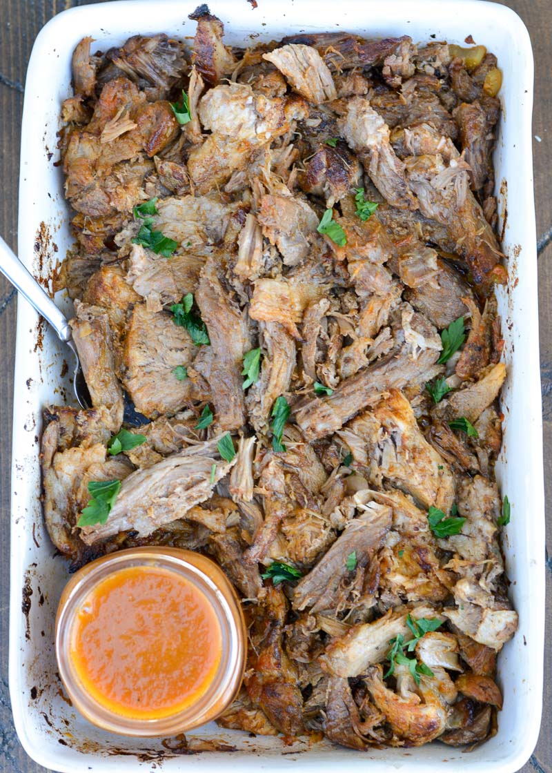 This Instant Pot Italian Pork features a tender Boston Butt that is cooked in a creamy tomato and white wine sauce! This pulled pork recipe is great for wraps, sandwiches, salads and more! 