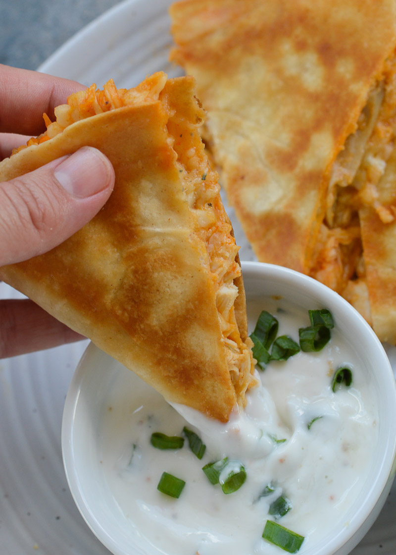 This Buffalo Chicken Quesadilla is packed full of tender shredded chicken, two types of cheese, and tangy buffalo sauce! Add the cool, creamy lime yogurt dip for an easy quick meal!